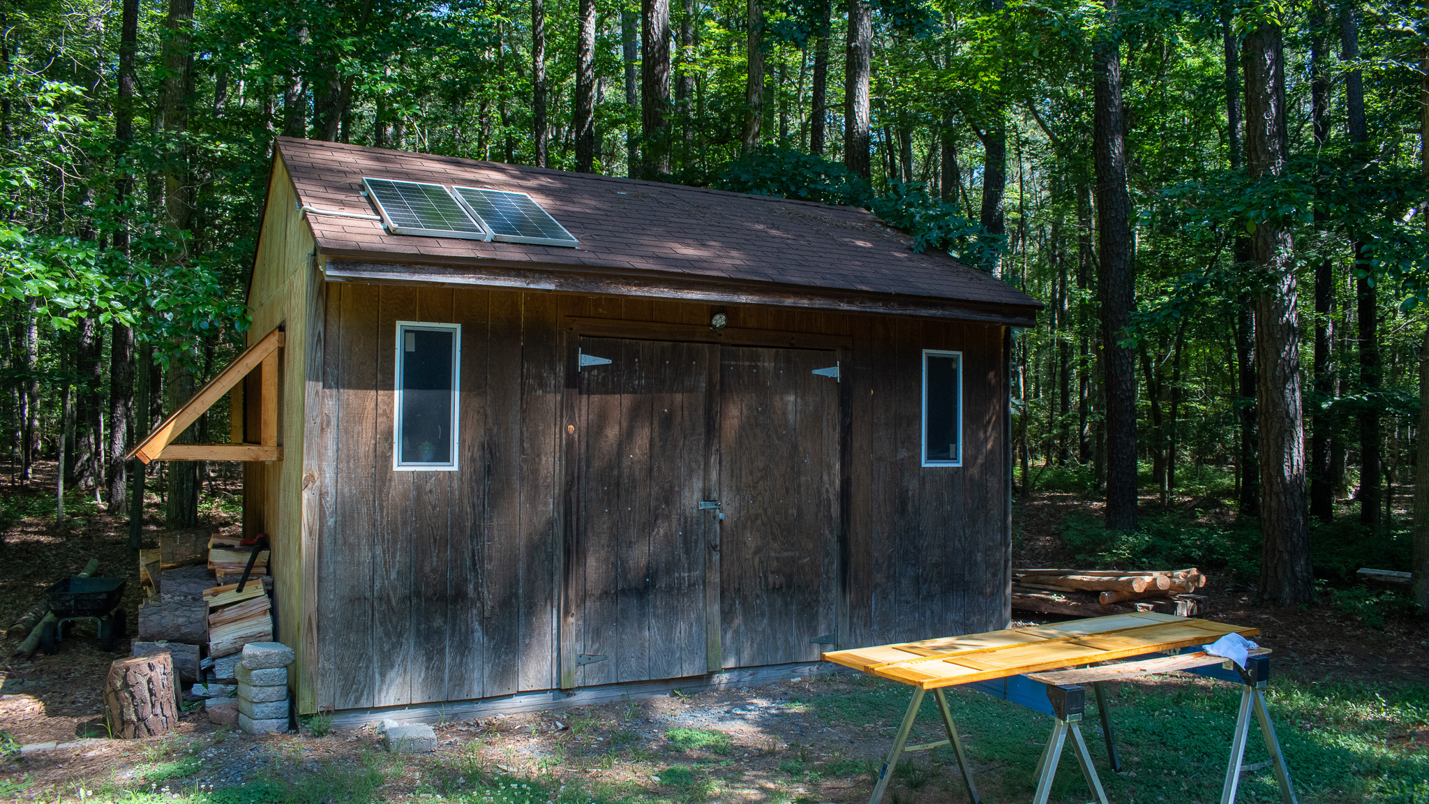 Off-grid solar power installation with battery arrays and monitoring equipment